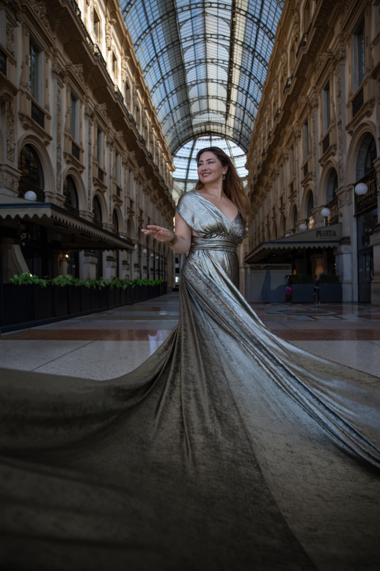 Anna Sanachina, opera singer, during an editorial photoshoot at Galleria Vittorio Emanuele II in Milan.